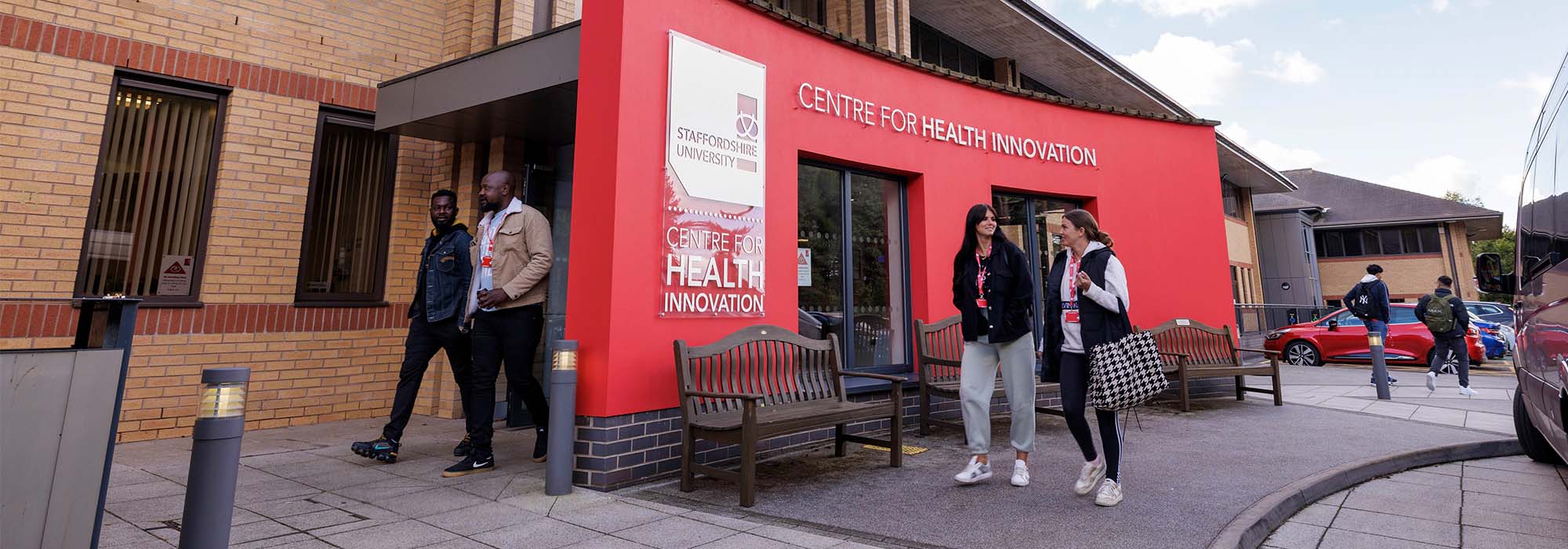 Students walking by the entrance of the Centre for Health Innovation at our Stafford campus