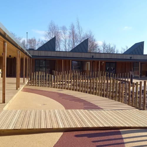 Building work on the new Forest School and Nursery. The new outdoor area with wooden decking and sustainably wooden features.