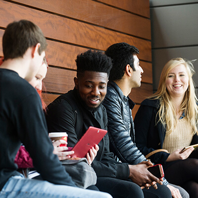 A group of students discussing international fees
