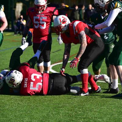 Defensive player 53 tackles Nottingham to the ground to stop their attack