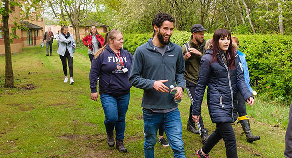 Group of undergraduate students walking to the nature reserve at Staffordshire University