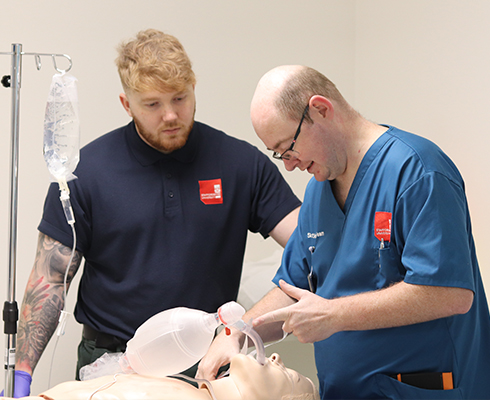 Colleagues taking part in a resuscitation training programme