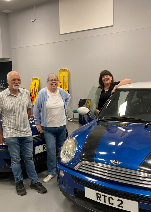 Three service users are taking part in nursing and paramedic simulations, there is a Blue Mini Cooper in the simulation