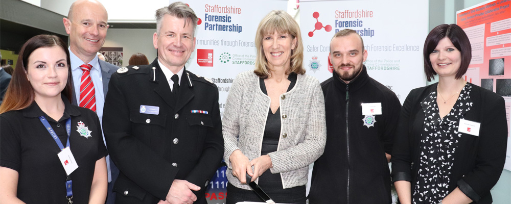 Member of the Staffordshire Forensic Partnership and University of Staffordshire are smartly dressed grouped together for a photograph at the event