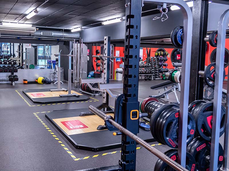 lifting platforms and free weight area in strength and conditioning room