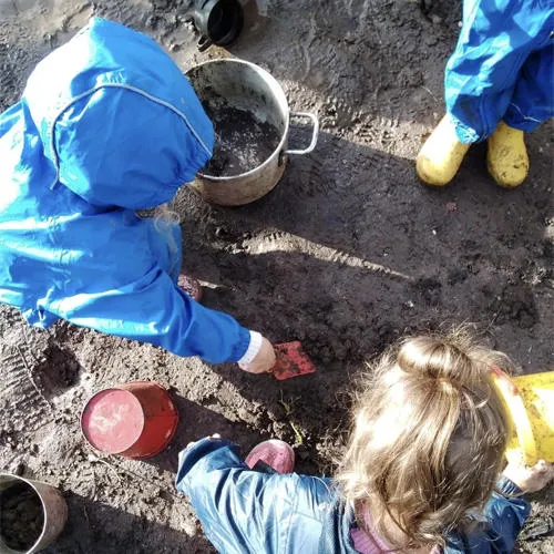 Children digging in the garden