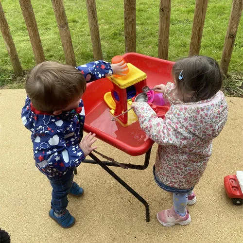 Children playing with toys outside