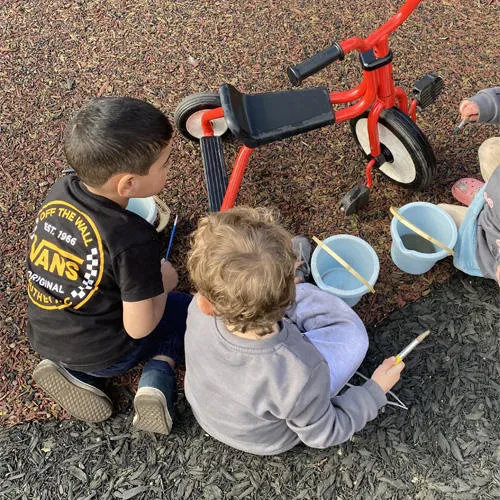 Children playing with toys outside