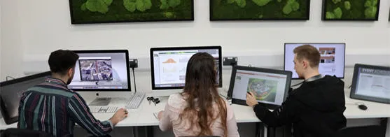 Students are in the architecture studio using the computers