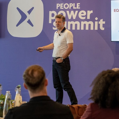 Andrew speaking at a conference