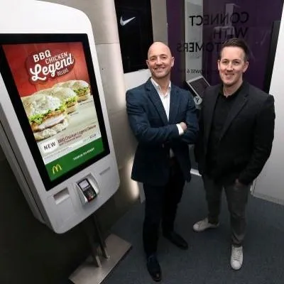 Right is Dean ward, standing in the middle is his associate, and the left is a self-serve kiosk.