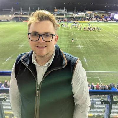 Seb smiling at a local football match