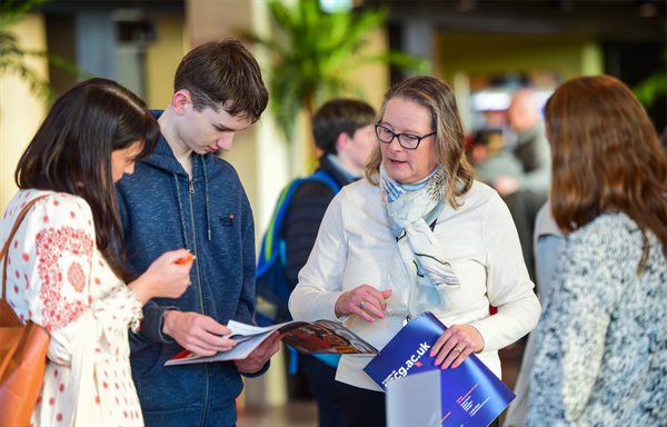 Image of students looking at information