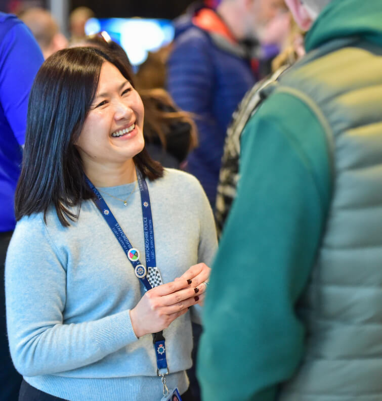 Employers chatting with staff at Apprenticeship Conference