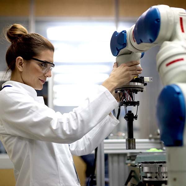 female worker using machinery