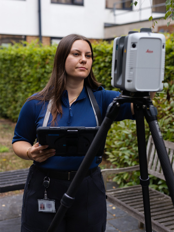 Julia using digital equipment outside