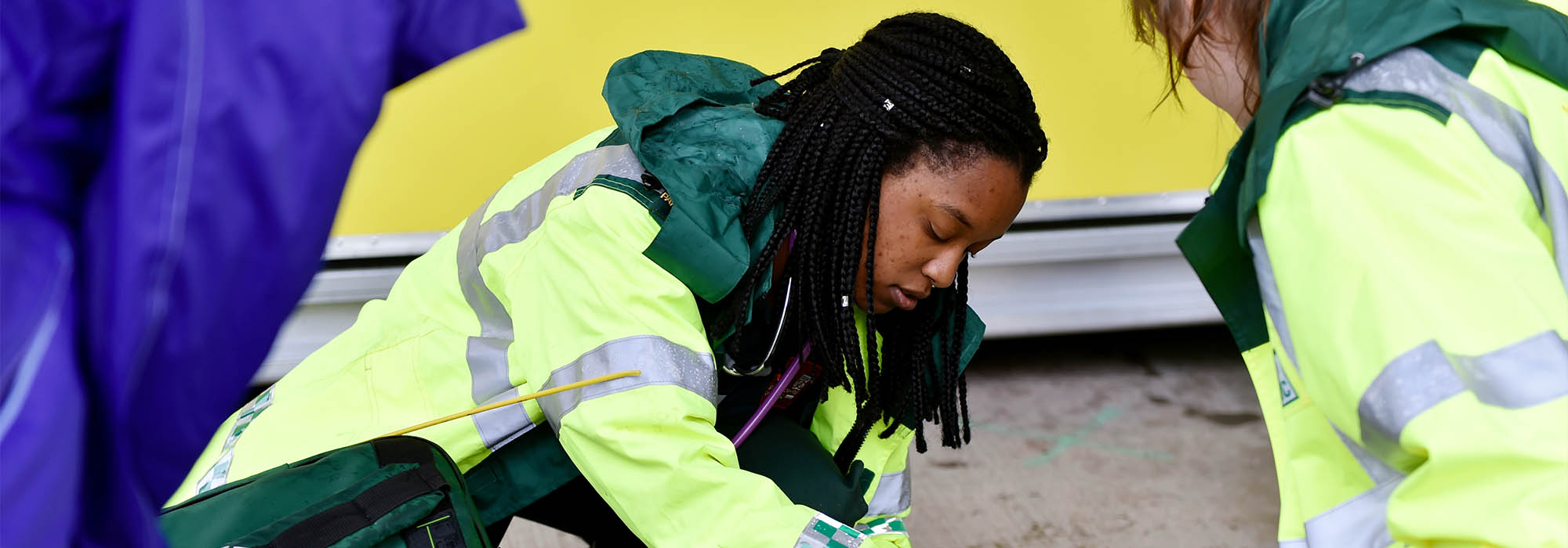 female paramedic undertaking training using a resus dummy