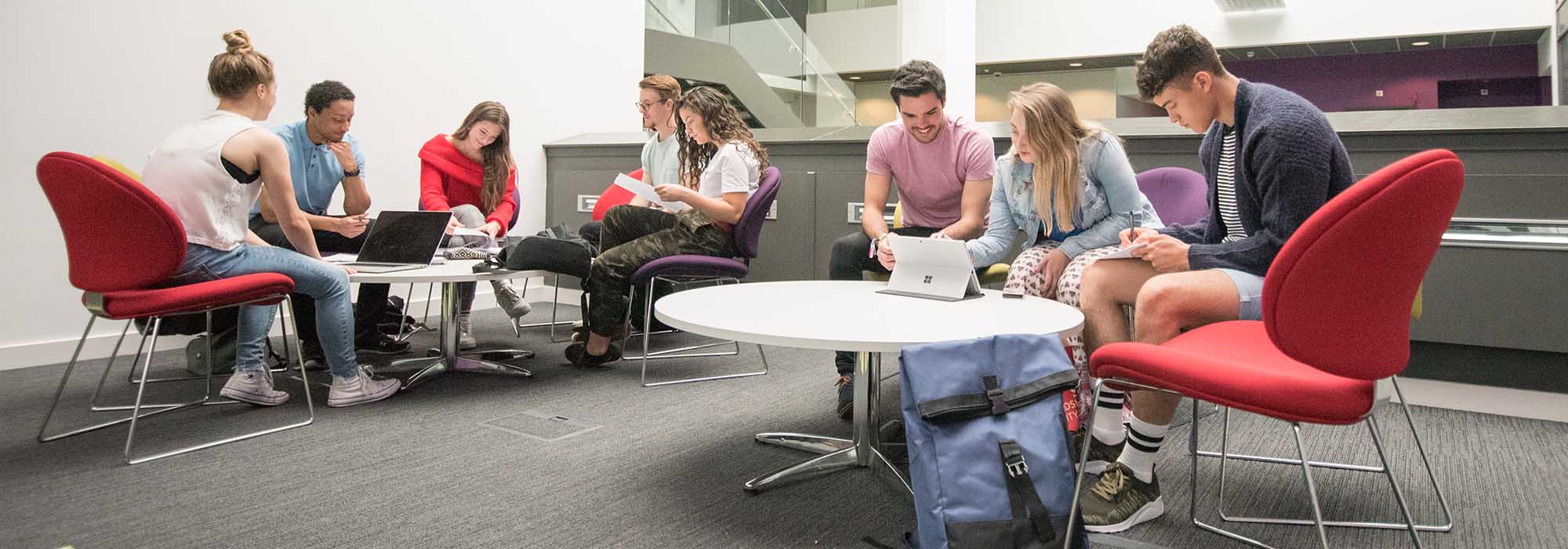 mixed group of students sitting in the science centre