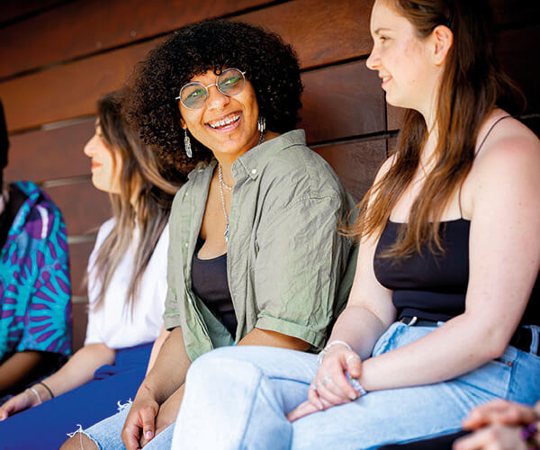 Smiling students sitting in a row