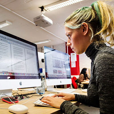 A student accessing support resources at a computer