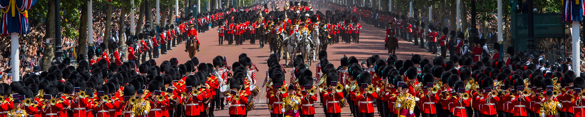 Soldiers of the Mass Bands and Household division marching in front of and behind HRH Queen Elizabeth