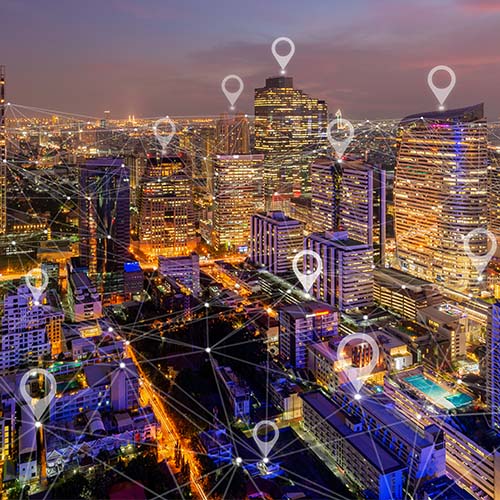 cityscape with location pins connecting areas of the city