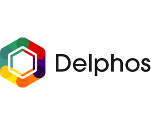 Logo for Delphos. A hexagonal shape on the left of the 'Delphos' text with a rainbow colouring and a white hexagon within the shape. 