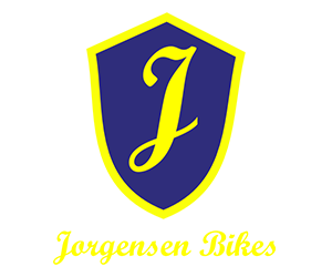 Logo for Jorgensen Bikes. Above is a blue and yellow shield icon with the letter 'J' in the middle.