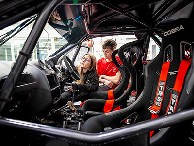 Students inside a motorsports car