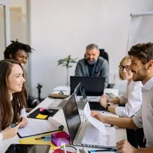 A group of people in a meeting