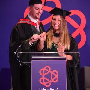 Ashley and Danielle Farrant in their graduationg caps and gowns