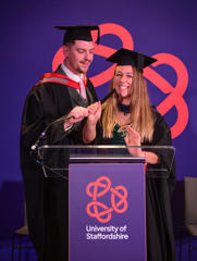 Ashley and Danielle Farrant in their graduationg caps and gowns