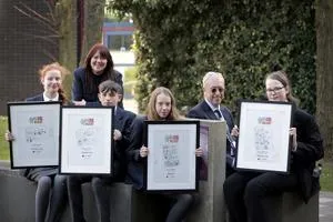Big Read prize winners holding their certificates