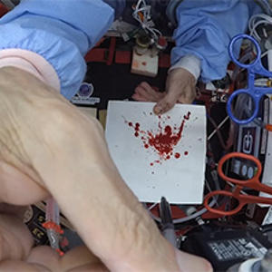 bloodstain patterns being recreated in reduced gravity aboard a parabolic aircraft 