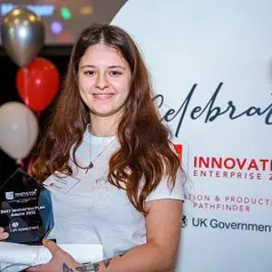 Briana Turcan holding her award