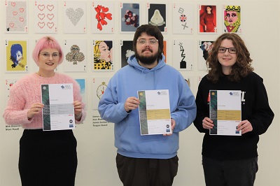 Students Emily Souter, Bryan Dowley and Sophie Slim holding their Brief Cases certificates
