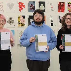 Students Emily Souter, Bryan Dowley and Sophie Slim holding their Brief Cases certificates