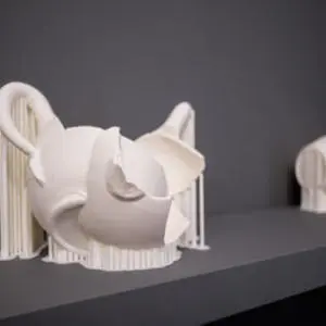 white artworks against dark background