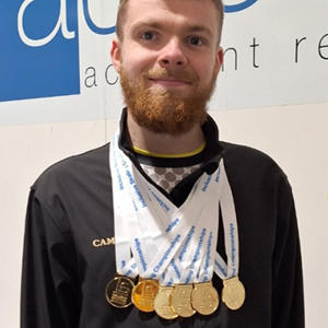 Cameron Sargent pictured wearing his six gold medals