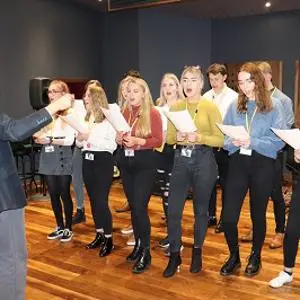University staff and students from Music and Sound singing their song