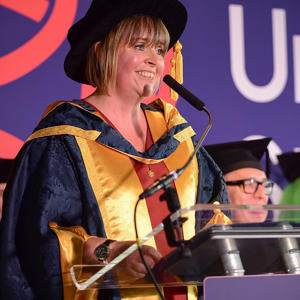 Cllr Abi Brown OBE in her honorary doctorate cap and gown