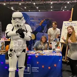 Students pictured with a Stormtrooper at the comic con event