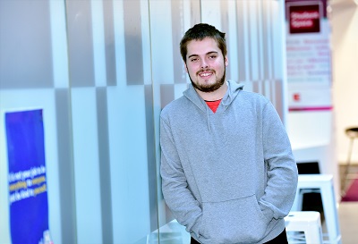 Bursary recipient Daniel Cotton pictured leaning against a wall in the Science Centre 