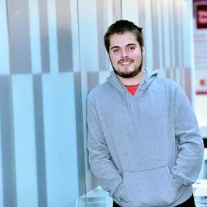 Bursary recipient Daniel Cotton pictured leaning against a wall in the Science Centre