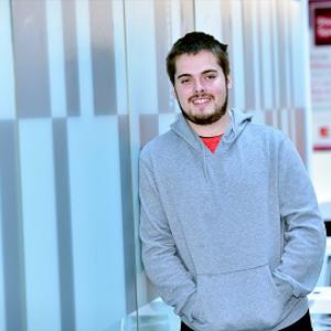 Bursary recipient Daniel Cotton pictured leaning against a wall in the Science Centre 