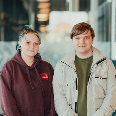 Kit and Corban pictured standing together