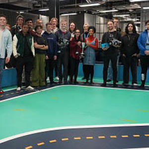 People standing on an indoor race track