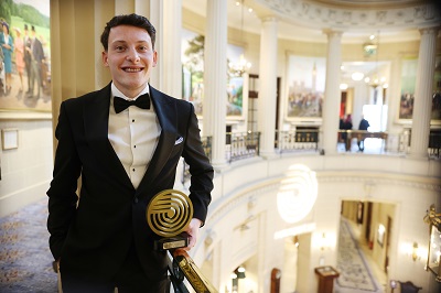 Dominic Gibbons photographed with his award 