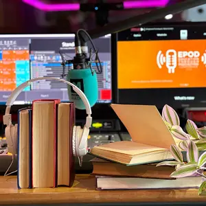 Headphones in front of a computer screen with the EPOD conference logo