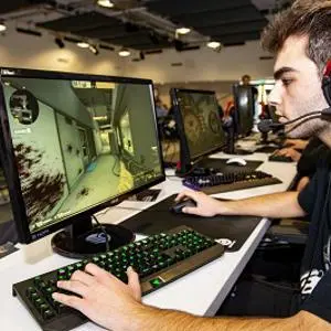 Student sat playing computer games
